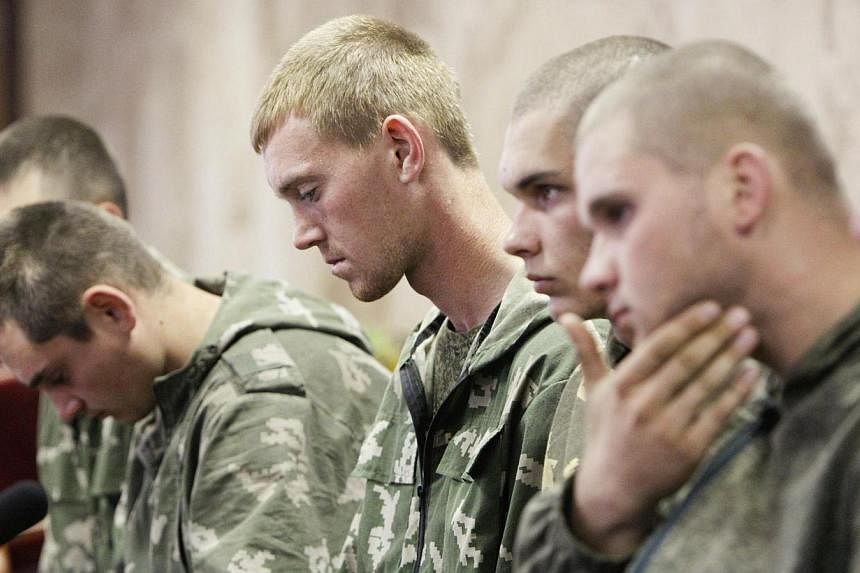 A group of Russian servicemen, who are detained by Ukrainian authorities, attend a news conference in Kiev on Aug 27, 2014.&nbsp;A senior Nato official said on Thursday, Aug 28, that "well over a thousand" Russian troops were operating inside Ukraine