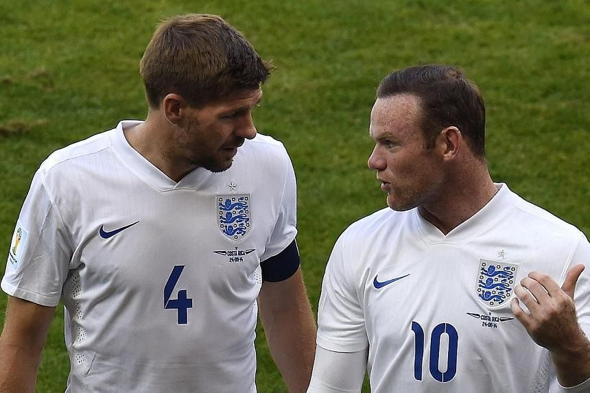 Manchester United striker Wayne Rooney (right) will succeed outgoing skipper Steven Gerrard (left) as England captain. -- PHOTO: AFP