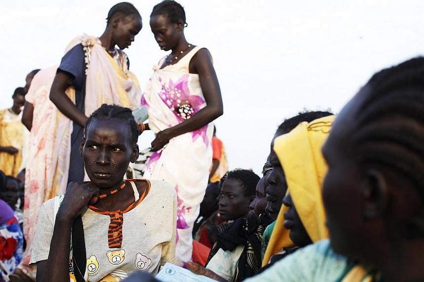 Displaced women wait for food distribution to start in the IDP camp in the UN base in Bentiu, Unity State on June 19, 2014.&nbsp;War-torn South Sudan faces possible famine early next year, the United Nations chief in the country warned on Thursday, a