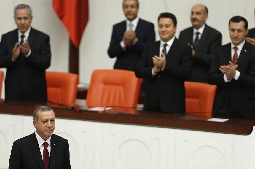 Turkey's new President Tayyip Erdogan (foreground) attends a swearing in ceremony at the parliament in Ankara on Thursday, Aug 28, 2014.&nbsp;-- PHOTO: REUTERS