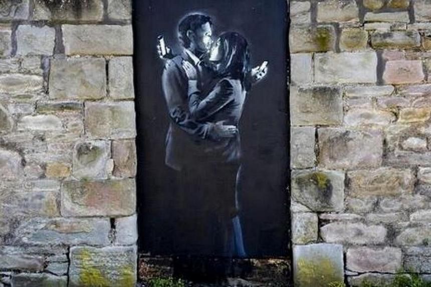 A work by the British street artist Banksy has saved a struggling youth club from closure after it was sold to a collector for £403,000 (S$889,016). --&nbsp;PHOTO: TWITTER
