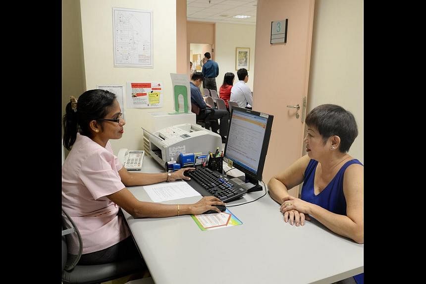 A patient making an appointment at Outram Polyclinic. Since SingHealth began allowing staff at its nine polyclinics to directly book appointments, internal appointment phone traffic has dropped by about 60 per cent.