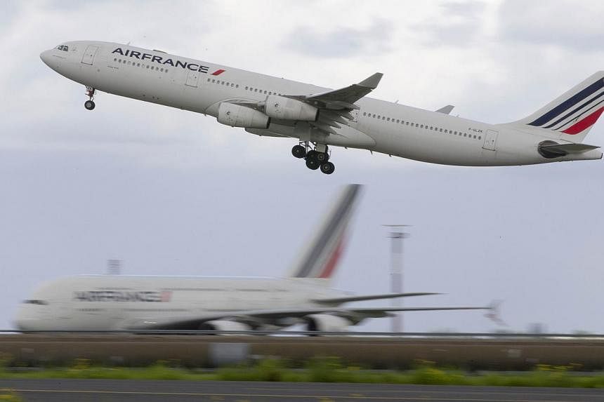 This file picture dated on Aug 18, 2014 shows An Air France Airbus 340 aircraft taking off at the Roissy-Charles-de-Gaulle airport, in Roissy-en-France. -- PHOTO: AFP