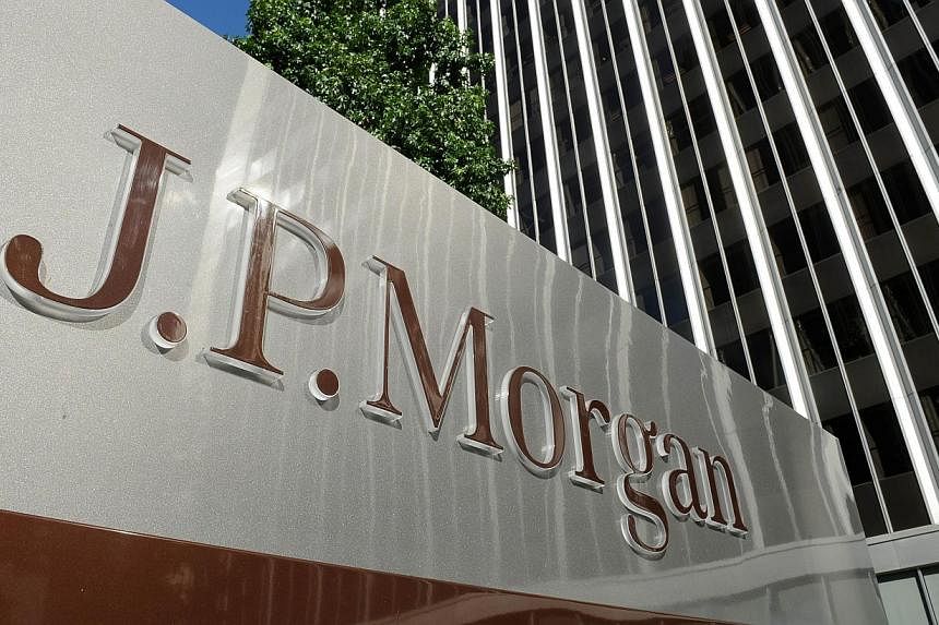 This Aug 8, 2013 file photo shows a JPMorgan sign outside the office tower housing the financial services firm's Los Angeles, California offices. -- PHOTO: AFP