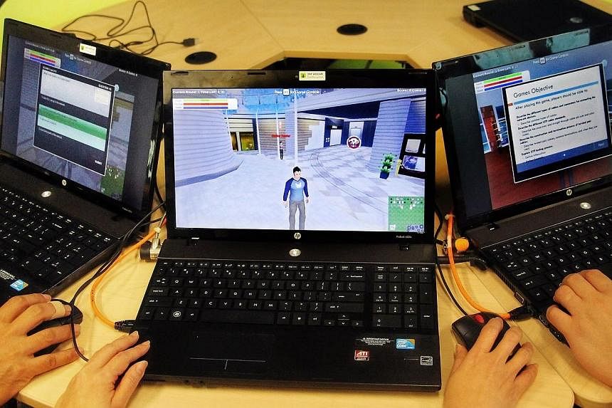 Students playing the Red Sentinels computer game. In it, students crack cases of internet fraud, defeat evil hacker characters, and defend TV networks from cyber attacks. -- PHOTO:&nbsp;ITE COLLEGE WEST