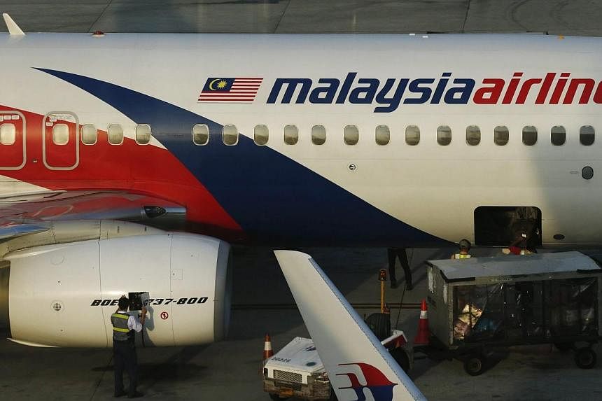 Malaysia Airlines (MAS) is set to slash 6,000 jobs&nbsp;as part of a major revamp after suffering the loss of two Boeing jets this year. -- PHOTO: REUTERS