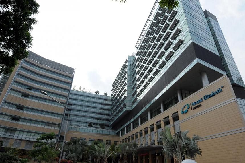 Mount Elizabeth Novena Hospital (MENH) has begun accepting patients from Tan Tock Seng Hospital (TTSH) this week, in a move to ease the massive bed crunch faced by public hospitals. -- PHOTO: ST FILE