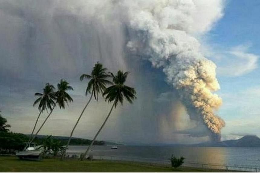 A volcano erupted on Friday in eastern Papua New Guinea, spewing rocks and ash into the air and forcing the evacuation of local communities, seismologists and reports said. -- PHOTO: TWITTER