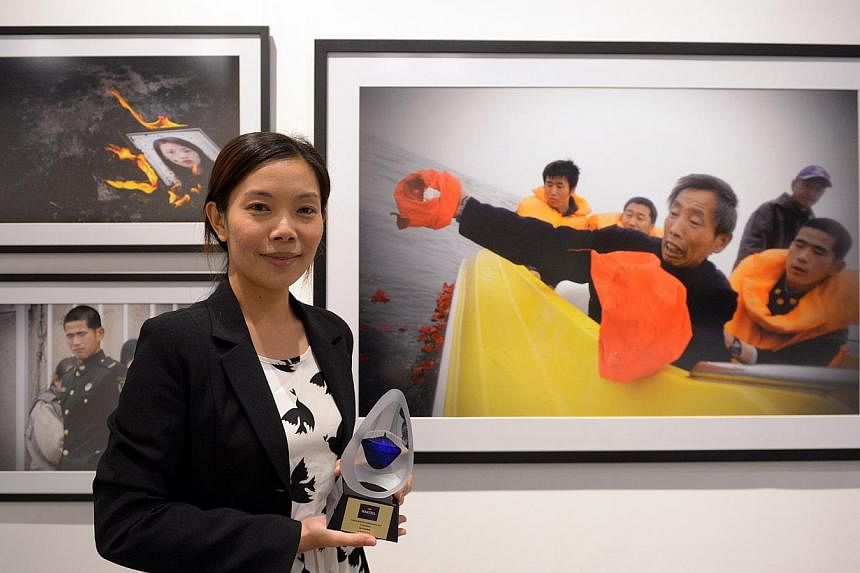 Straits Times photojournalist Neo Xiaobin, who won Singapore's most coveted photography award, the Icon de Martell Cordon Bleu 2014.&nbsp;-- ST PHOTO: LIM SIN THAI