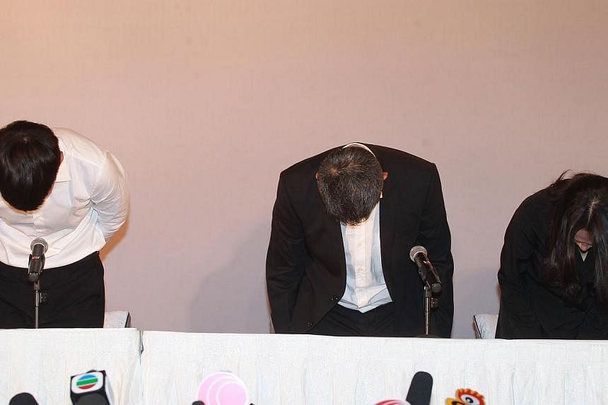 (From left) Taiwanese movie star Kai Ko and his father and mother apologise during a press conference after he was released on Aug 29, 2014, in Beijing. -- PHOTO: AFP