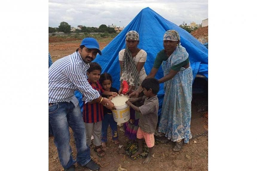 The famous "ice bucket" challenge is inspiring thousands of Indians to follow suit, but with a twist - they are replacing ice with rice in a bid to help the country's vast population of poor, hungry people. -- PHOTO: RICE BUCKET CHALLENGE/FACEBOOK&nb
