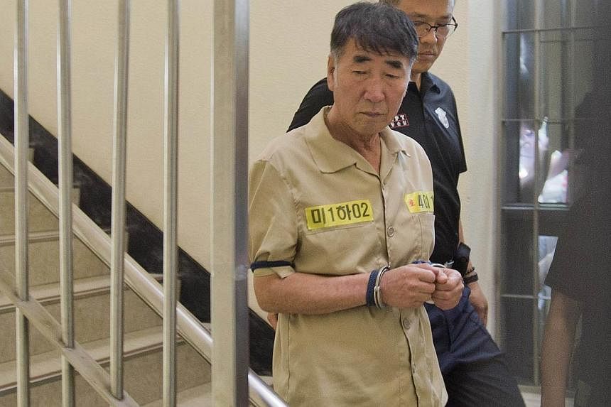 Lee Joon Seok, captain of sunken ferry Sewol, arrives at a court in Gwangju on June 10, 2014. Lee told a court on Friday he was just following established practice in not making safety checks before the vessel set off&nbsp;-- PHOTO: REUTERS