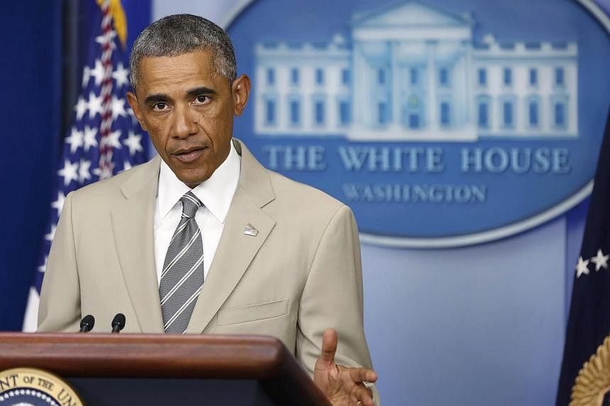 US President Barack Obama makes a statement from the White House Press Briefing Room ahead of a meeting with his national security council in Washington, August 28, 2014. His suit was the subject of some ridicule on social media. -- PHOTO: REUTERS
