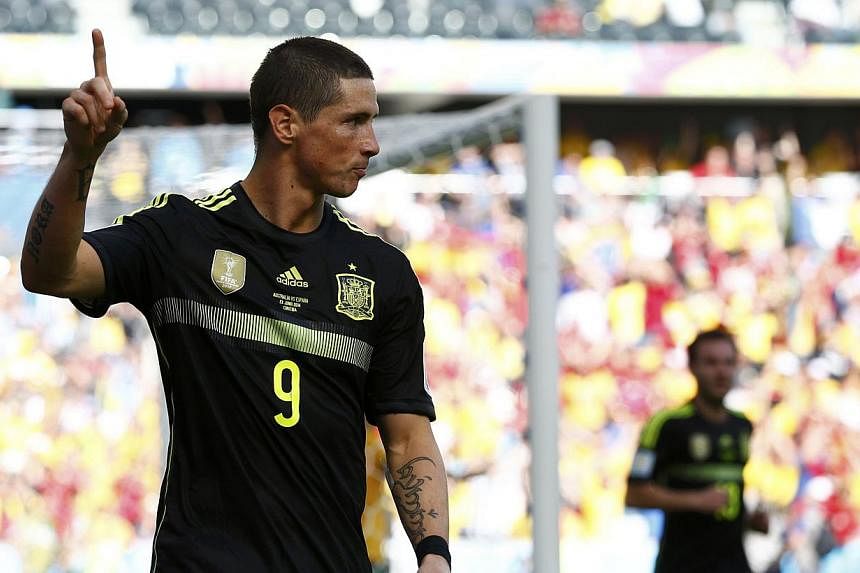 Chelsea's Fernando Torres of Spain celebrates after scoring a goal during the 2014 World Cup Group B soccer match between Australia and Spain on June 23, 2014. The 30-year-old striker is set to end his miserable spell at Stamford Bridge by joining AC