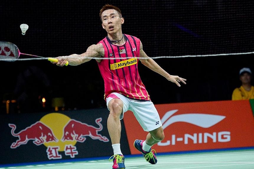 Malaysia's Lee Chong Wei competes against China's Wang Zhengming during the men's singles quarter-final match at the 2014 BWF Badminton World championships held at the Ballerup Super Arena in Copenhagen on August 29, 2014. -- PHOTO: AFP&nbsp;