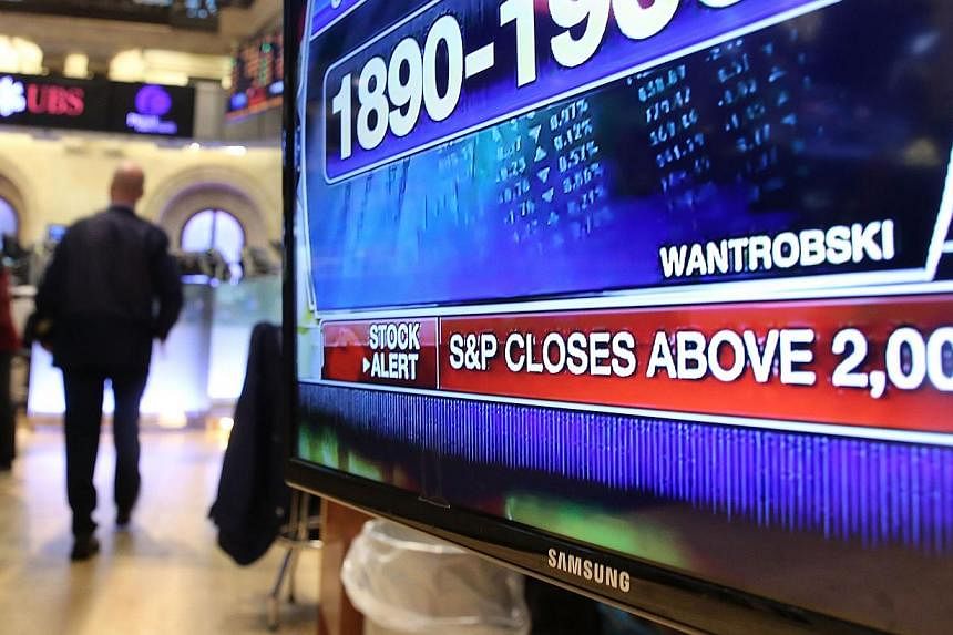A television monitor displays news on the floor of the New York Stock Exchange on August 26, 2014 in New York City. The S&amp;P 500 pushed back above 2,000 on Friday - the milestone it closed above for the first time on Tuesday - to finish at 2,003.3