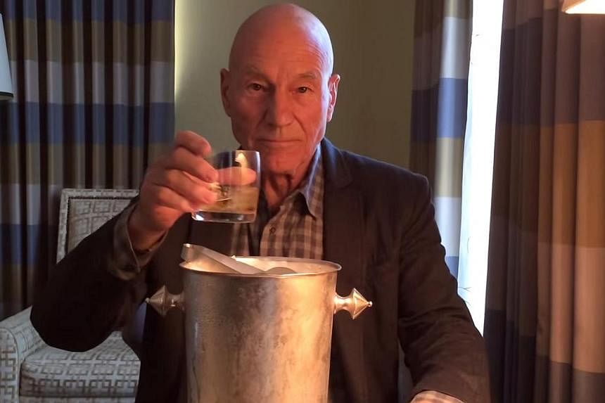 Actor Patrick Stewart modified the ice bucket challenge, selecting a few cubes of ice to add to a glass of whisky after signing a cheque for an undisclosed sum of money. -- PHOTO: SCREEN GRAB FROM YOUTUBE