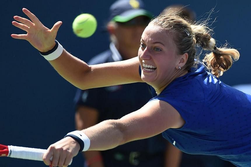 Petra Kvitova of the Czech Republic plays against Aleksandra Krunic of Serbia during their 2014 US Open women's singles match at the USTA Billie Jean King National Tennis Centre August 30, 2014 in New York. Krunic won 6-4 6-4. -- PHOTO: AFP&nbsp;