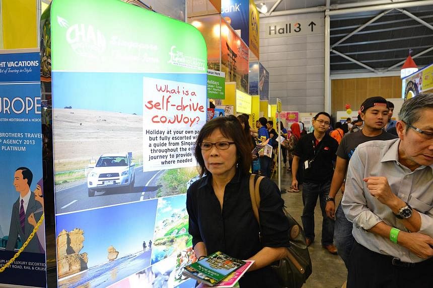 Visitors at Chan Brothers' booth at the recent Natas Holidays fair. The agency says the number of bookings for self-drive holidays so far this year has risen 30 per cent over last year's figure.