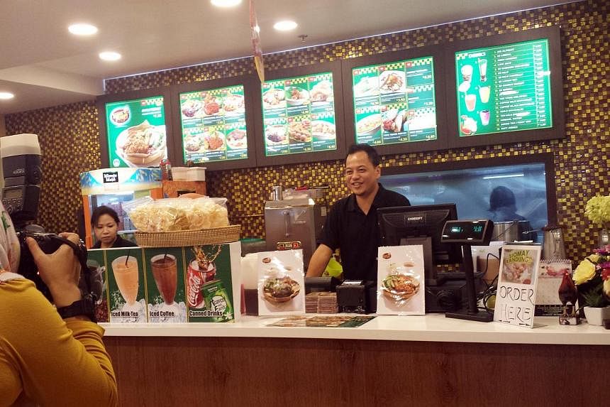 Mr Edy at one of his food outlets in Singapore. He now has 11 Dapur Penyet outlets in places like Clementi and Tiong Bahru.