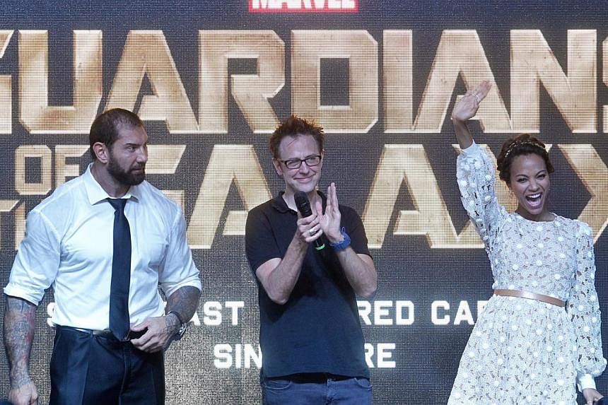 (From left) WWE wrestler Bautista, director James Gunn and Zoe Saldana were in Singapore to promote their movie, Guardians Of The Galaxy. -- PHOTO: ST FILE