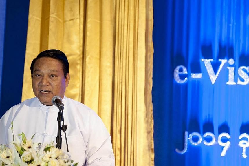 Myanmar Minister of Immigration and Population U Khin Yi speaks during the opening ceremony of an online electronic E-Visa system in Yangon. -- PHOTO: AFP