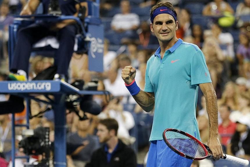 Roger Federer of Switzerland celebrates after defeating Marcel Granollers of Spain in the men's singles play following their match at the 2014 US Open tennis tournament in New York, on Aug 31, 2014. -- PHOTO: REUTERS
