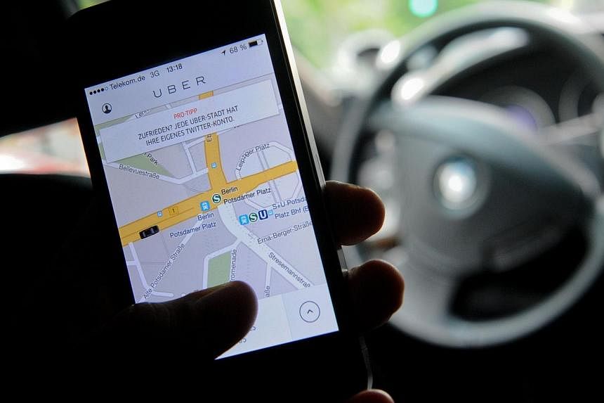 A German court has slapped an injunction on the popular car pick-up service Uber (pictured) across Germany because it lacked the necessary legal permits, it was announced on Tuesday. -- PHOTO: AFP