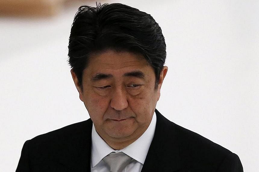 Prime Minister Shinzo Abe's plan for Japan's economy to generate self-sustained growth on the back of his three policy "arrows" of massive monetary easing, spending and reform appears to be faltering - but no magic solution is in sight.-- PHOTO: REUT