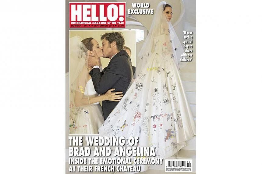 Angelina Jolie walked down the aisle in a wedding dress decorated with designs taken from her six children's artworks. People magazine's latest cover shows the actress in a simple, white satin gown filled with the colourful images of their drawings. 
