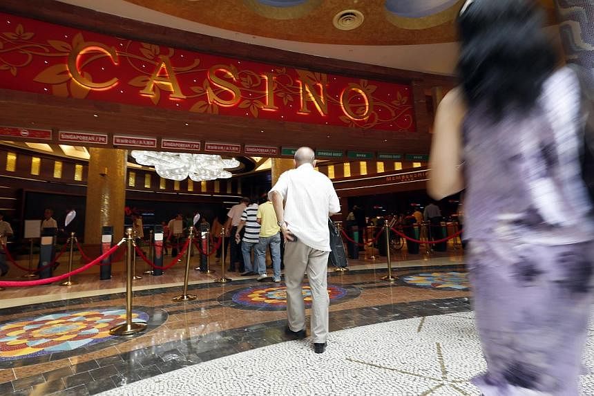 Visitors at the casino at Resorts World Sentosa (RWS), photographed on June 7, 2012. -- PHOTO: ST FILE