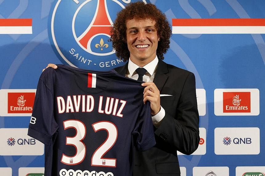 David Luiz of Brazil poses with his new Paris St Germain team jersey after a news conference at the Peninsula Paris luxury hotel in Paris, on Aug 7, 2014. -- PHOTO: REUTERS