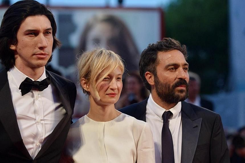 Italian director Saverio Costanzo (right), Italian actress Alba Rohrwacher and US actor Adam Driver arrive for the screening of the movie "Hungry Hearts" presented in competition at the 71st Venice Film Festival at Venice Lido on Aug 31, 2014. -- PHO