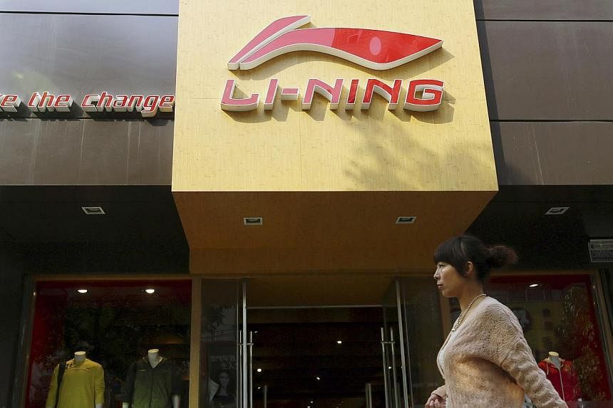 A woman walks past a Li Ning sportswear store in Huaibei, Anhui province in this Oct 17, 2012 file picture. -- PHOTO: REUTERS