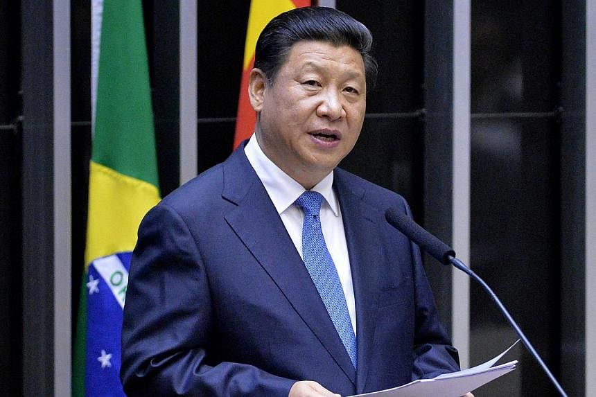 Chinese President Xi Jinping speaks before the Congress in Brasilia on July 16, 2014. -- PHOTO: AFP