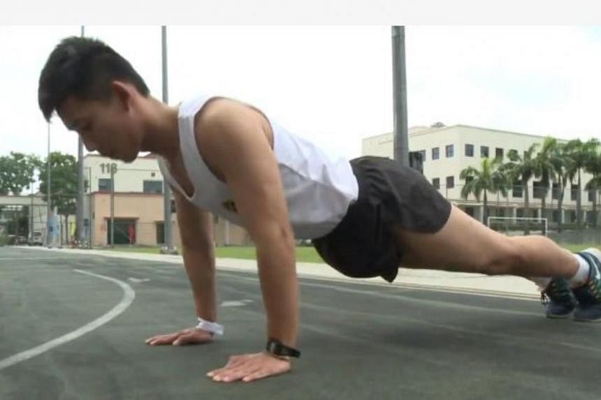 A fitness specialist demonstrates how to do a proper push-up in this video screengrab. -- PHOTO: CYBERPIONEER/FACEBOOK