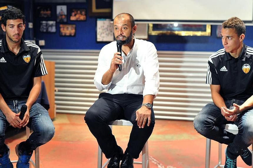 Interview with Valencia coach Nuno Santo (centre), captain Dani Parejo (left), and striker Rodrigo Moreno (right), at Brewerkz on Sept 2, 2014. -- ST PHOTO:&nbsp;&nbsp;LIM YAOHUI