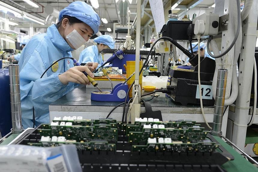 Hopes that the downbeat manufacturing sector had turned a corner were dashed on Tuesday, with new figures showing that factory activity unexpectedly shrank in August in its worst showing this year. -- PHOTO: ST FILE