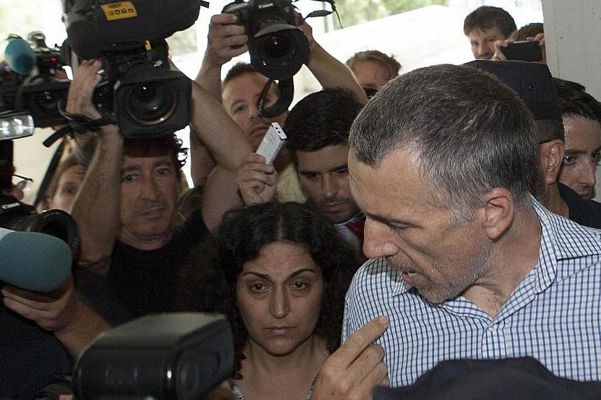British parents Brett and Naghemeh King (centre) arrive at the maternity ward at the Regional University Hospital in Malaga on Sept 3, 2014, where their five-year-old son, Ashya King, was placed after Spanish police arrested his parents.&nbsp;The fat