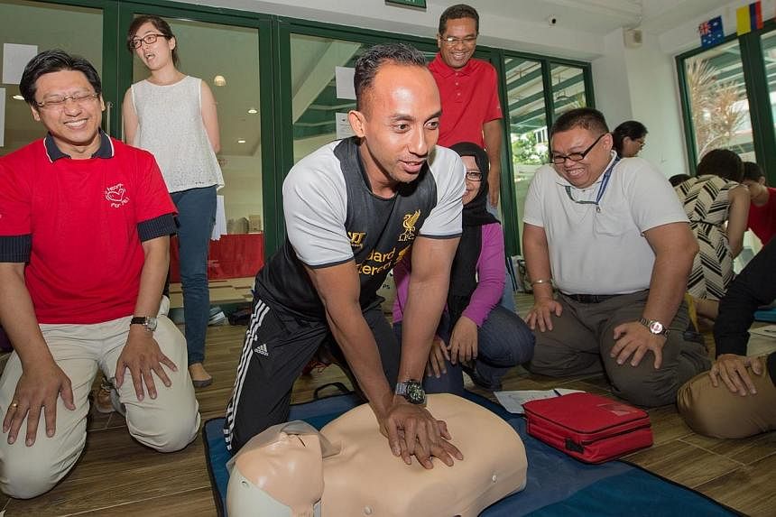School staff learning how to become lifesavers as part of the Singapore Heart Foundation’s “Start A Heart” project on 30 June 2014. More cardiac arrest patients are receiving cardiopulmonary resuscitation, or CPR, from bystanders, leading to a 