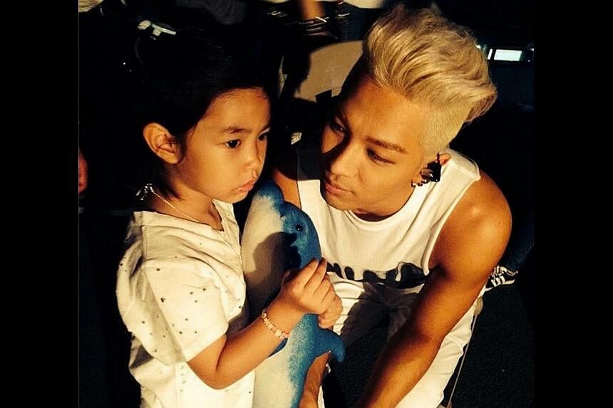 Lee Haru (seen here with Taeyang of BigBang) is the four-year-old daughter of rapper Tablo and a hot favourite among A-list celebrities. -- PHOTO: TAEYANG/INSTAGRAM