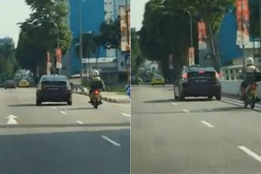 Screengrabs from a video, posted by Facebook user Alan Kong, showing&nbsp;a Toyota Prius taxi swerving twice into the lane of an oncoming motorcycle in a reckless manner.&nbsp;-- PHOTO: ALAN KONG/FACEBOOK