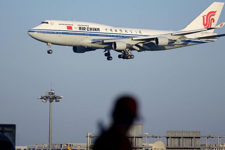 This picture taken on Sept 3, 2014 shows an Air China Boeing 747 preparing to land at Beijing Capital International airport.&nbsp;China will need more than 6,000 new aircraft over the next 20 years, US manufacturer Boeing forecast Thursday - an incre