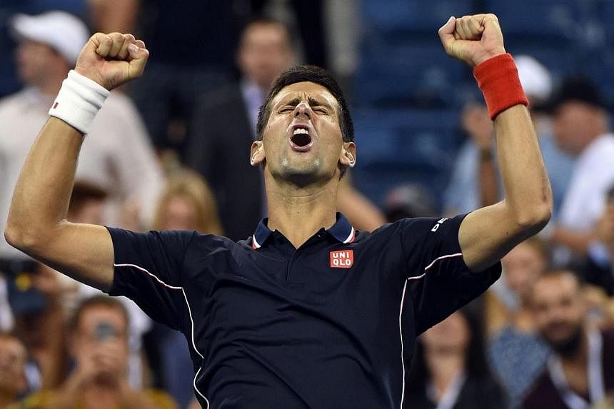 Novak Djokovic of Serbia celebrates his victory over Andy Murray of Great Britain during their US Open 2014 men's quarterfinals match at the USTA Billie Jean King National Center on Sept 3, 2014 in New York. -- PHOTO: AFP