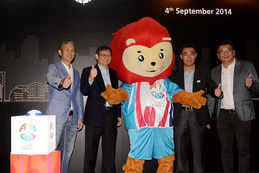 (From left) Mr Anthony Chong, Mr Patrick Lee, Mr Toh Boon Yi and Mr Danny Lam with the SEA games 2015 mascot at the announcement of local&nbsp;communication design and production group Kingsmen Creatives as the SEA Games'&nbsp;official venue planning