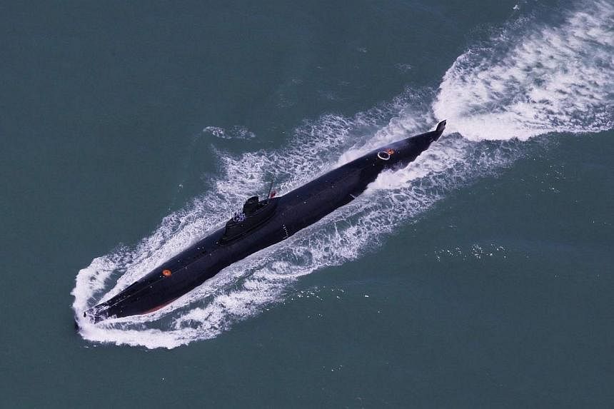 This undated photo taken in August 2014 shows a submarine of the People's Liberation Army Navy's Nanhai Fleet taking part in a marine training session in the South China Sea.&nbsp;-- PHOTO: AFP
