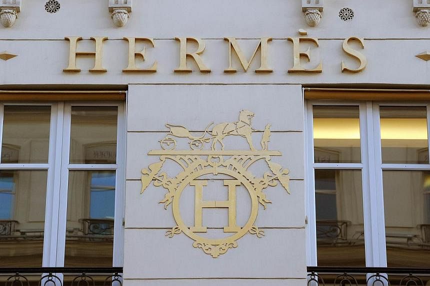 &nbsp;A long and bitter battle that has gripped the luxury goods industry and pitted two of France's richest families against each other came to an unexpected end on Wednesday when LVMH and Hermes agreed to a truce. -- PHOTO: AFP&nbsp;