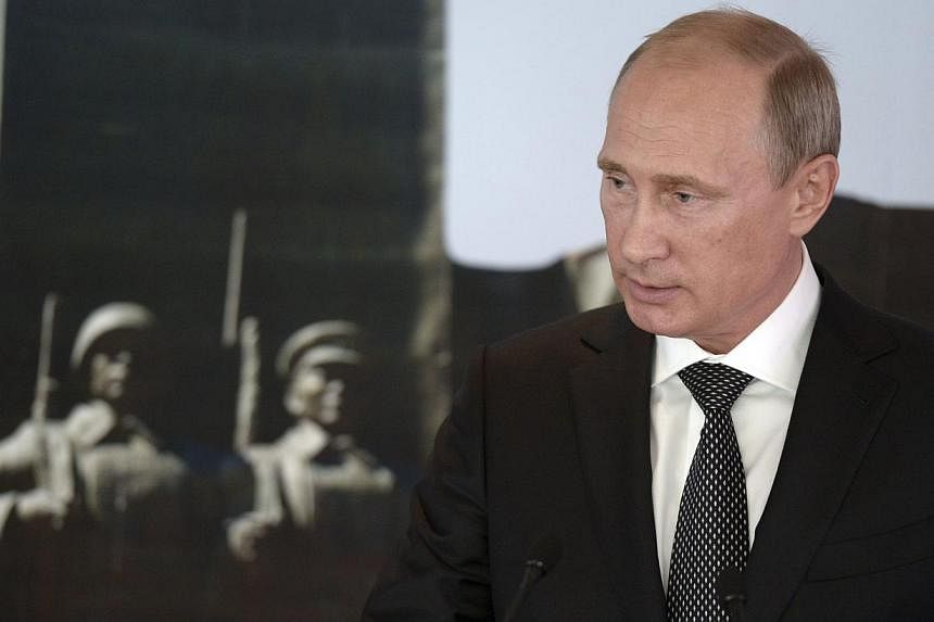 Russian President Vladimir Putin said on Wednesday a deal to end fighting in eastern Ukraine could be reached this week, a clear attempt to show the West he was trying to de-escalate the conflict despite renewed shelling. -- PHOTO: REUTERS