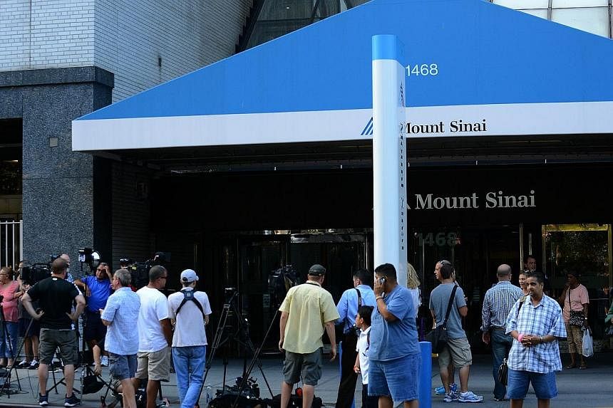 A general view of press outside of Mount Sinai Hospital in New York City on Sept 4, 2014. Joan Rivers passed away on Sept 4, 2014 after suffering respiratory and cardiac arrest during vocal cord surgery on Aug 28, 2014. -- PHOTO: AFP