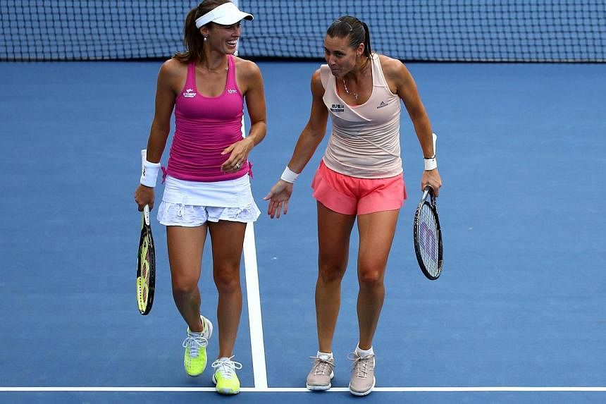 Martina Hingis (left) of Switzerland and Flavia Pennetta of Italy in their women's&nbsp;doubles quarterfinal &nbsp;match against Kveta Peschke of the Czech Republic and Katarina Srebotnik of Slovenia on Day Nine of the 2014 US Open at the USTA Billie